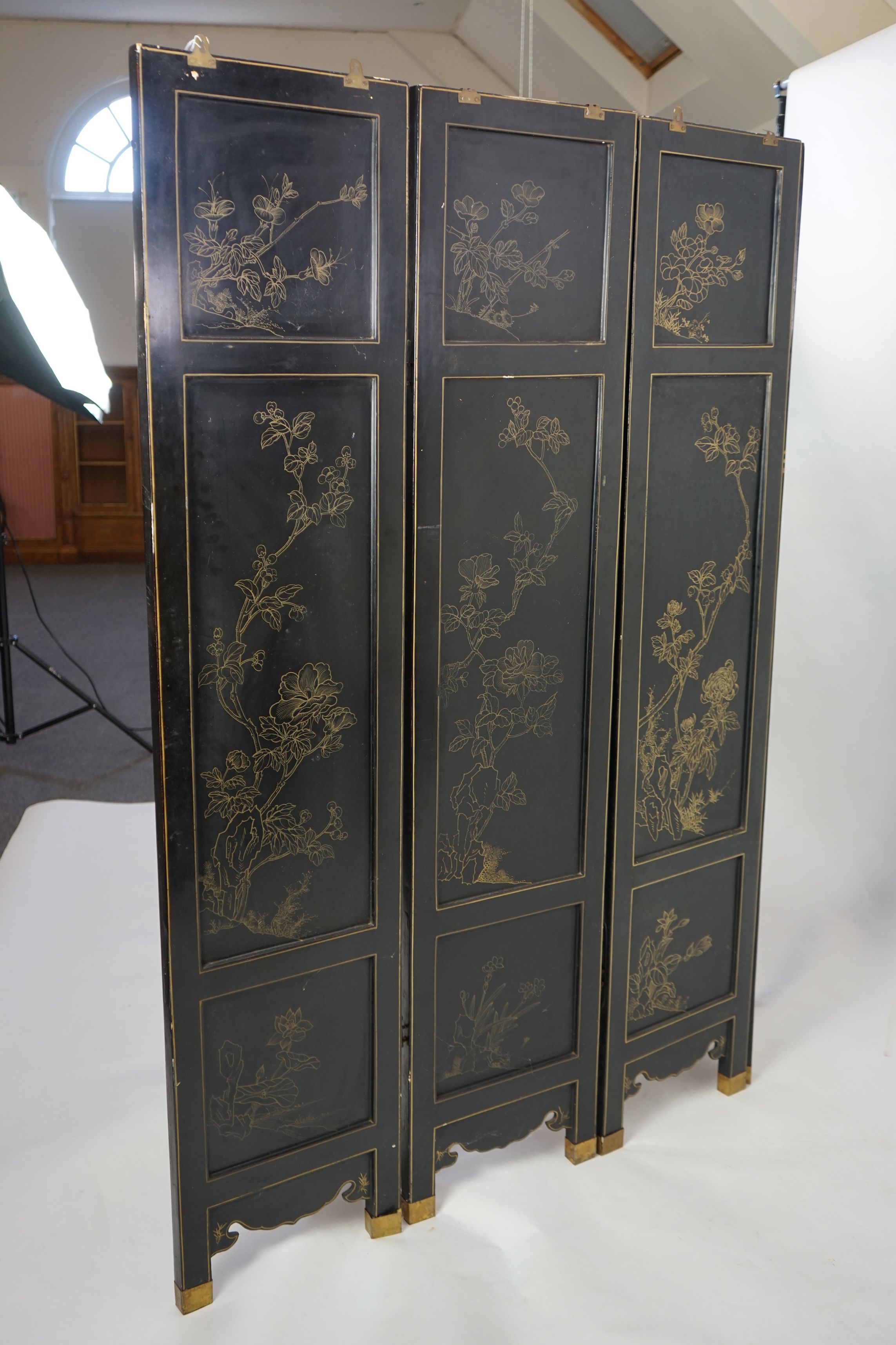 A Chinese tixi lacquer and carved soapstone overlaid six panel screen, mid 20th century